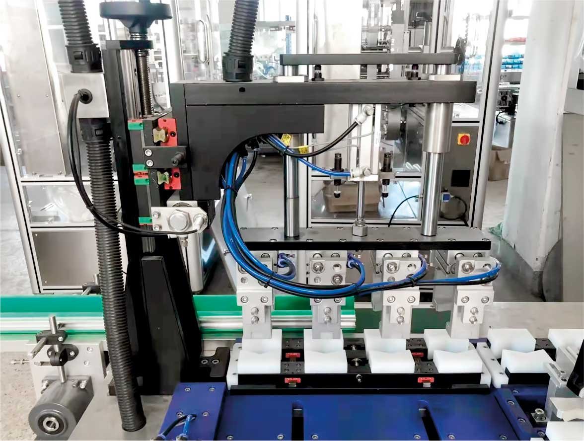Automatic four-head liquid &cream cycle filling line - Image 3